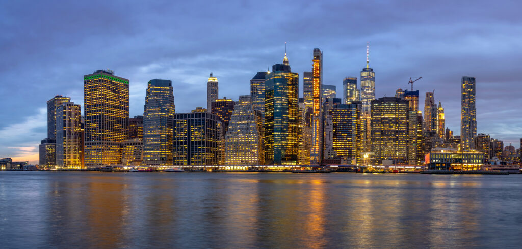 panorama scene of new york cityscape with brooklyn bridge beside